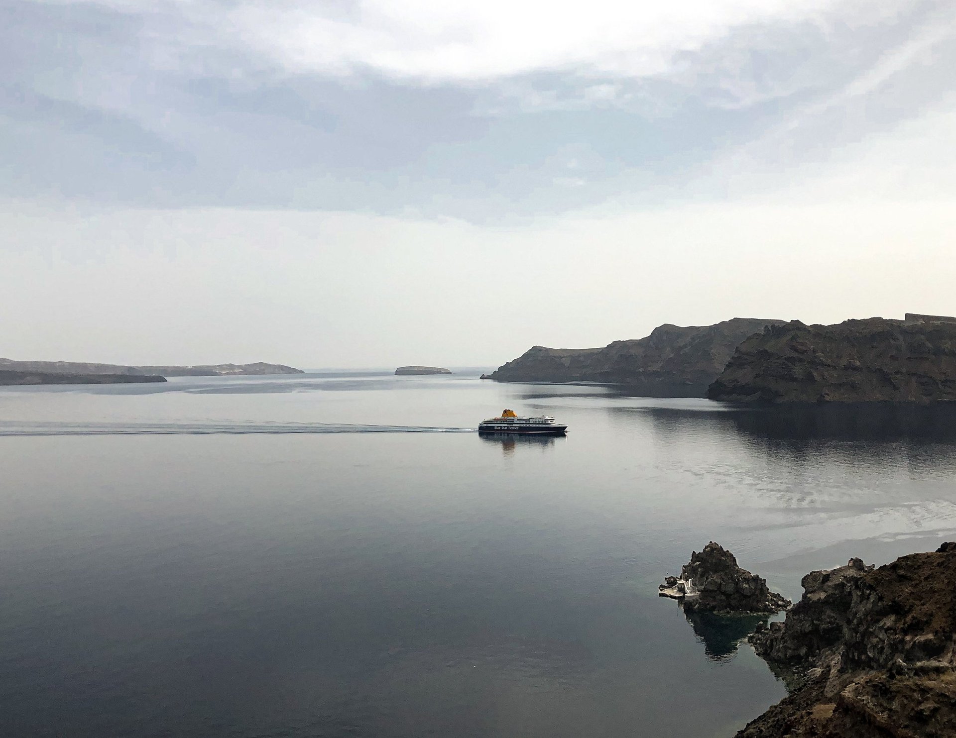 Steam rising from fumaroles on the Nea Kameni volcanic island, Santorini