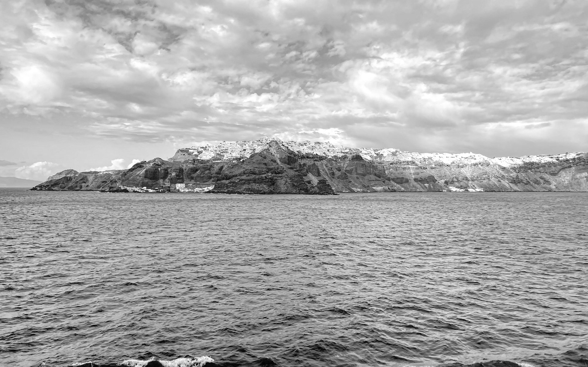 Storm clouds gathering over the Santorini caldera - explosive nature reawakened