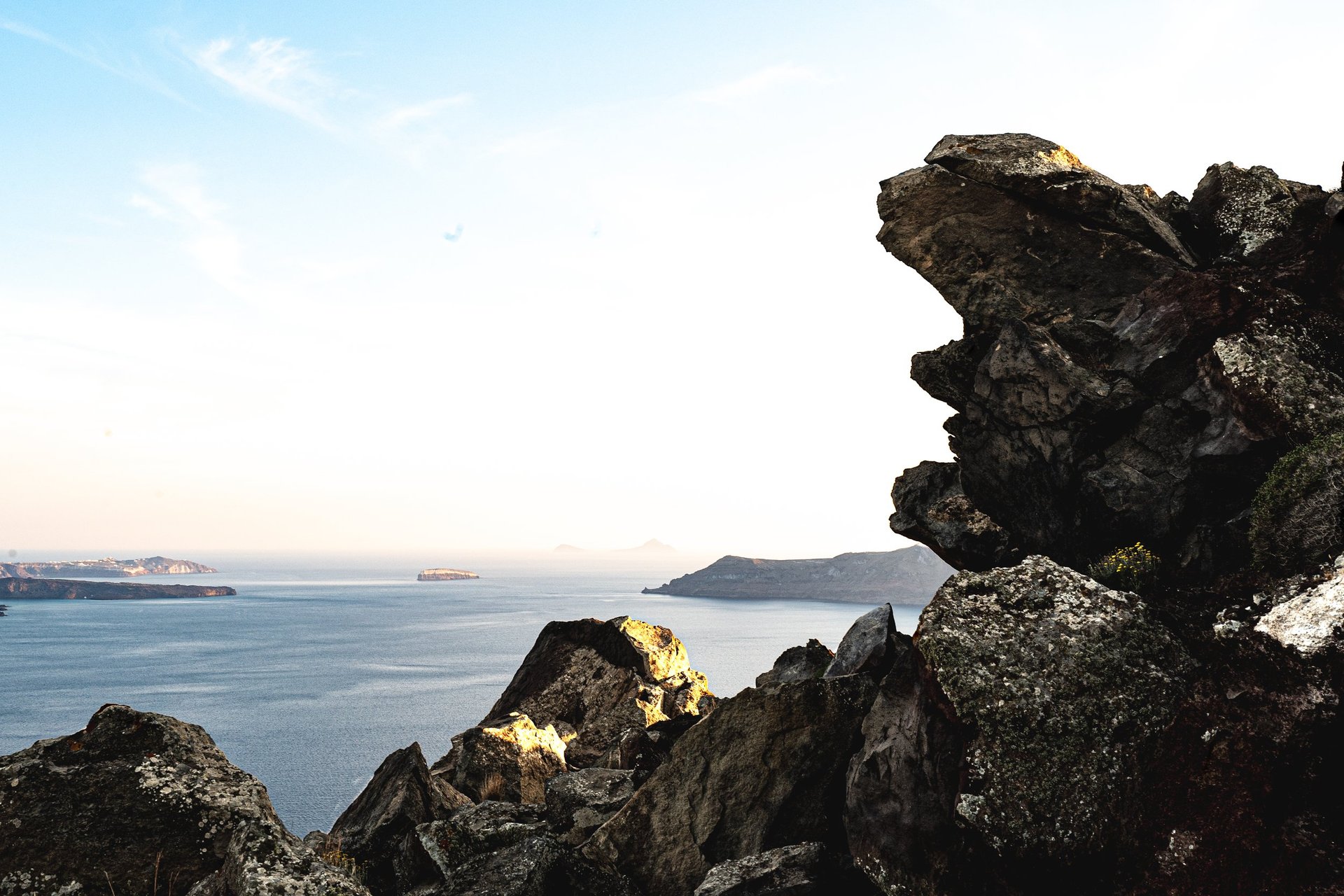 The layered pumice and lava cliffs of the Santorini caldera wall