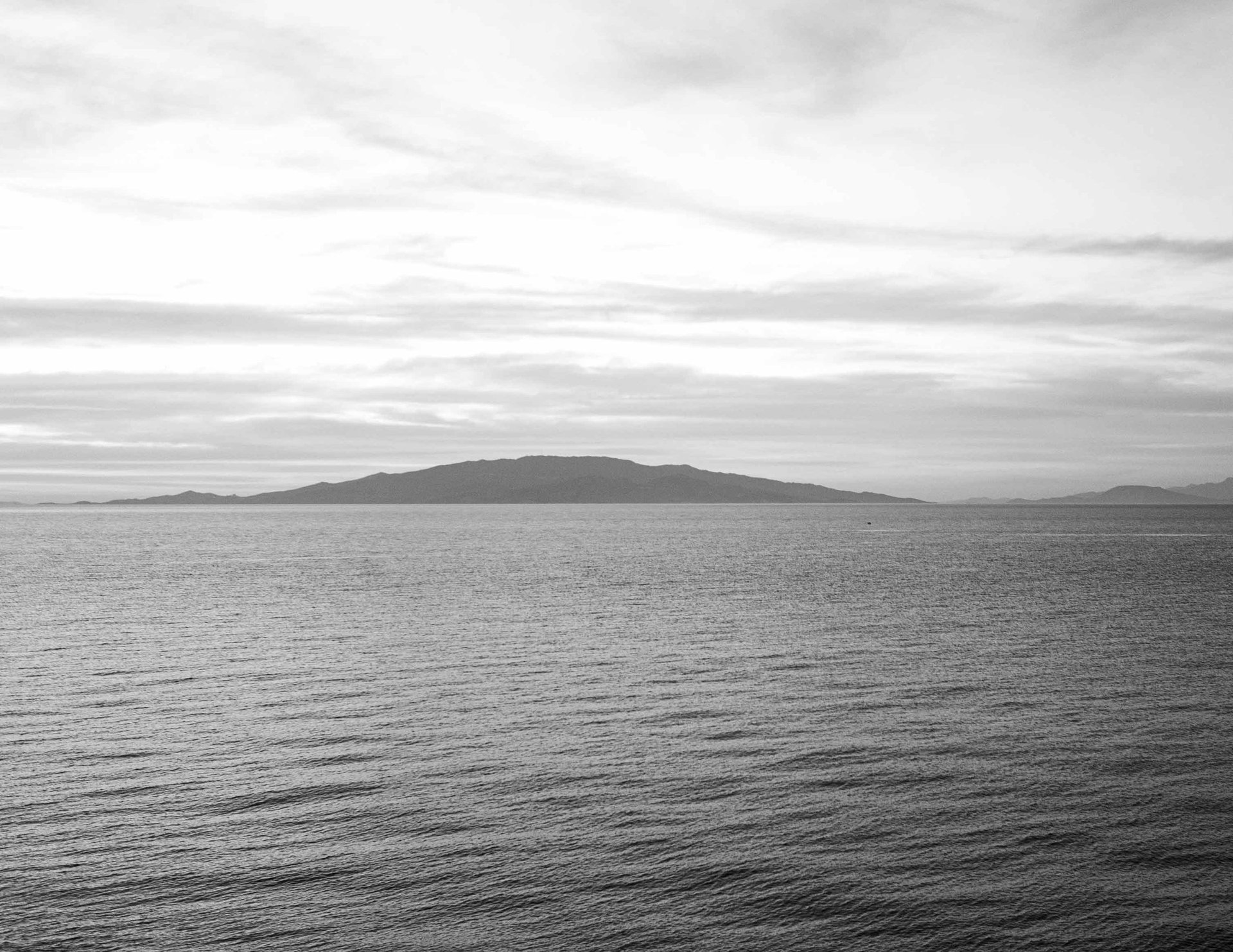 White foam on the Aegean - evoking the Colombo dove that named Kolumbo