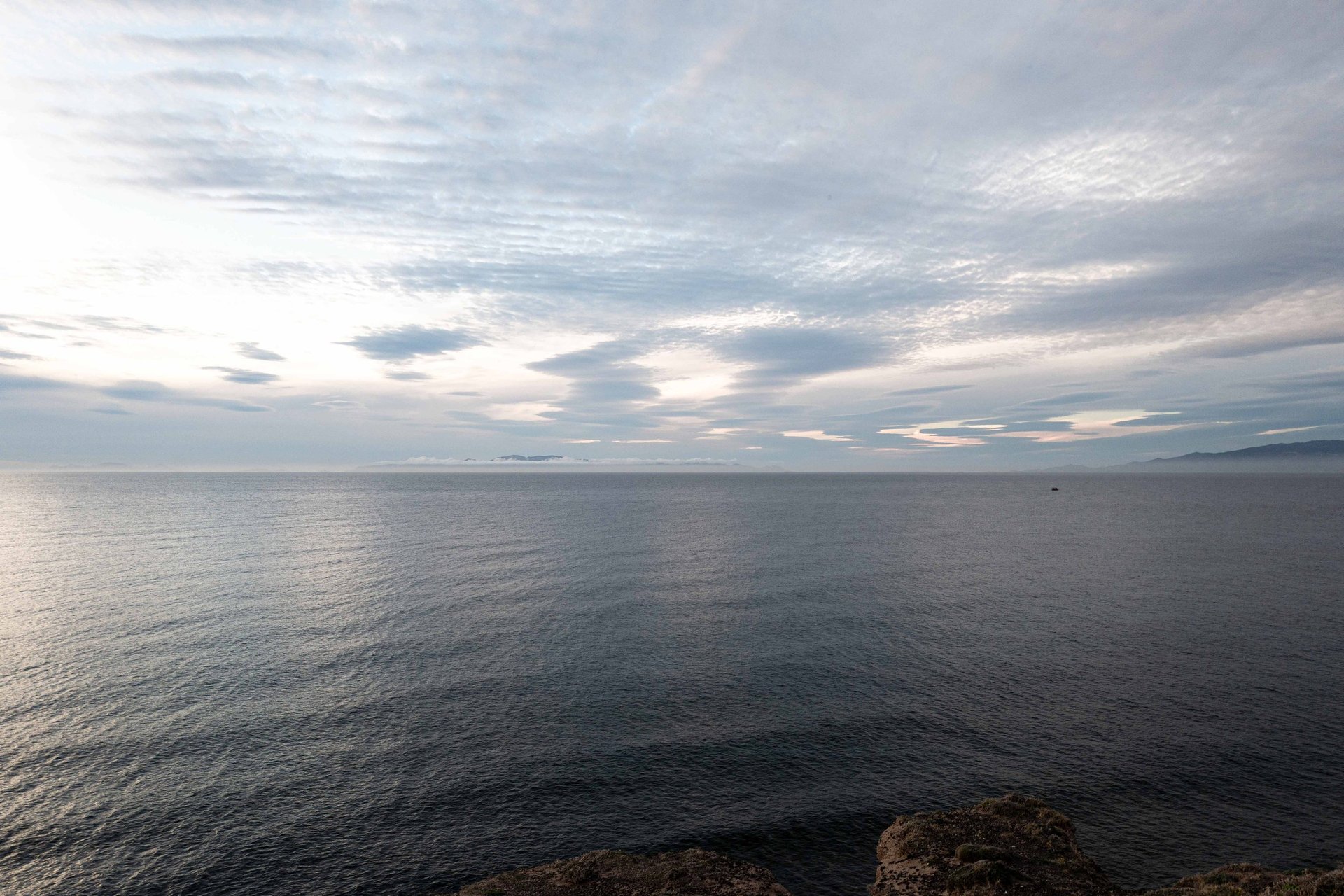 The shoreline where Kolumbo's eruption once turned the sea to white