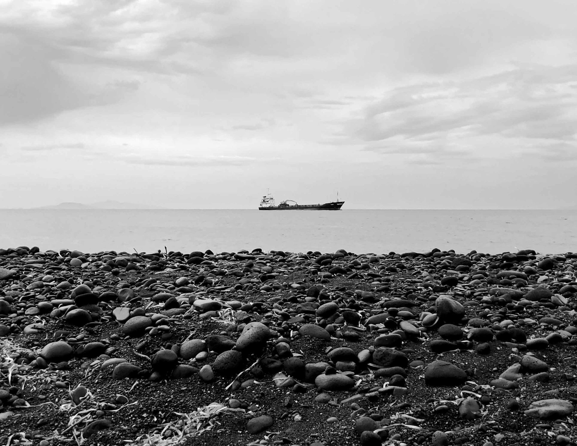 The Kolumbo strait at golden hour - light meeting the volcanic deep